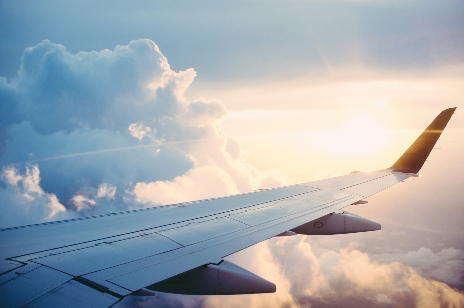 View of an aircraft wing above the clouds